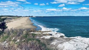 A beach with clear skies and calm waters. - Five Islands Waterfront Retreat (Georgetown)