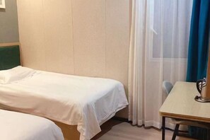 A hotel room with two single beds, a small table with a chair, and a window with sheer curtains. - Waiting Qingju Hotel (9th People's Hospital Lujiabang Road Subway Station Branch) (Shanghai)