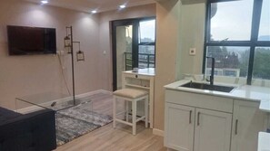 Superior Apartment, City View | Private kitchen | Fridge, microwave, cookware/dishes/utensils, dining tables - Kenzi Suites (Kisii)