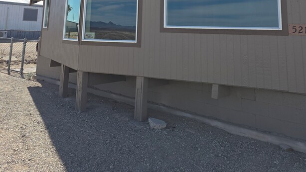 A building with large windows and a sloped roof.