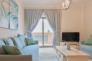 Luxury Apartment, 2 Bedrooms, Sea View | Television - SIMPLY COMFORT Amazing BeachFront Apartments near Atlantis Waterpark (Dubai)