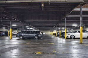 A multi-level parking garage with cars parked on multiple levels.