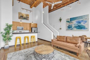 A modern interior with a kitchen, dining area, and living space.