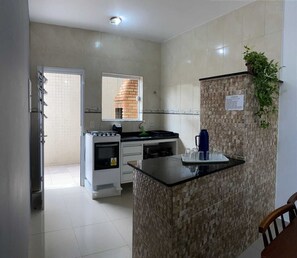 Family Apartment | Private kitchen - Condomínio Gelatti (Ubatuba)