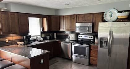 Spacious 4-bedroom house in amazing Omaha with WiFi, backyard oasis.