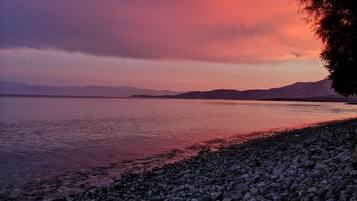 On the beach, sun-loungers