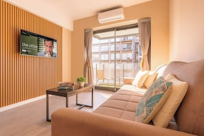 Appartement Deluxe, balcon, vue ville | Coin séjour