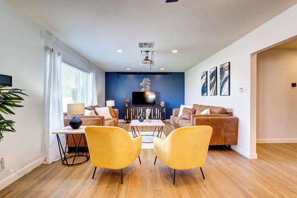 Cozy living room with smart TV and comfy seating.