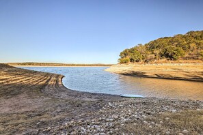 Experience a serene lakeside retreat with a rocky shoreline and tranquil atmosphere.