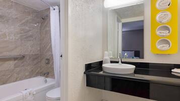 Combined shower/bathtub, towels, toilet paper