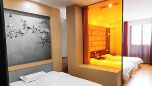 A hotel room with a bed, a painting on the wall, a window with curtains, and a view of the outside.