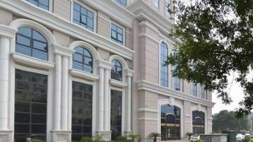 A large building with multiple arched windows and a symmetrical facade.