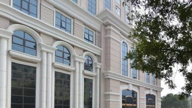 A large, classical building with arched windows and columns, likely a hotel or public building. - Kunlun Hotel (Hengshui Zhongxin Street) (Hengshui)