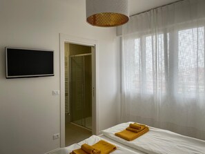 2 slaapkamers, een strijkplank/strijkijzer, gratis wifi, beddengoed