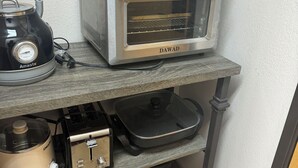 A kitchen with a DAWAD toaster oven, a black kettle, a coffee maker, and a slow cooker on a wooden shelf. - Resort Condo NEXT to Ski Run w/ Pool & Hot tub! (Brian Head)