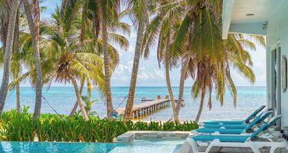 Escape to this stunning 4-bedroom villa nestled on the white sands of northern Ambergris Caye, Belize.