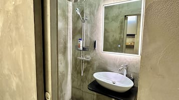 Shower, free toiletries, hair dryer, slippers