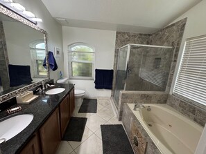 Shower, jetted bath, hair dryer, towels - Perfect getaway at this beautifully 3-bedroom, 2-bathroom home in Palm Bay, FL. (Palm Bay)