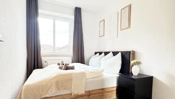 1 bedroom, desk, bed sheets