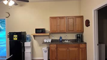 Fridge, microwave, coffee/tea maker, cookware/dishes/utensils