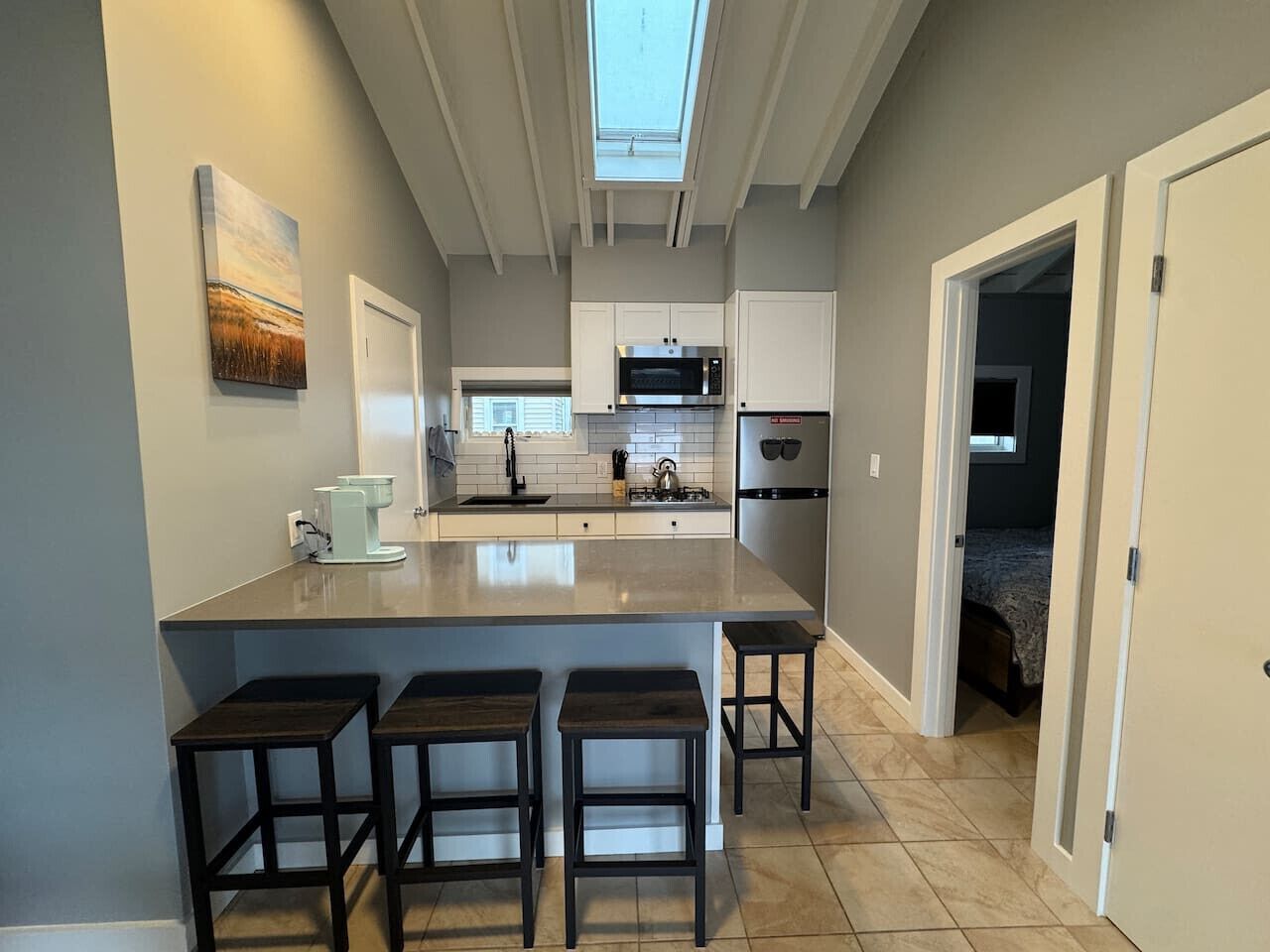Fridge, microwave, stovetop, coffee/tea maker