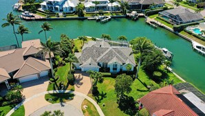 A residential area with houses, a dock, and a body of water. - Waterfront, Private Pool, Walk to Tigertail Beach, Best of Marco! (Marco Island)