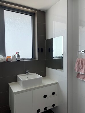 Shower, hair dryer, towels, soap