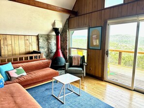TV, fireplace - Design-forward Frio cabin with epic views & pool (Concan)