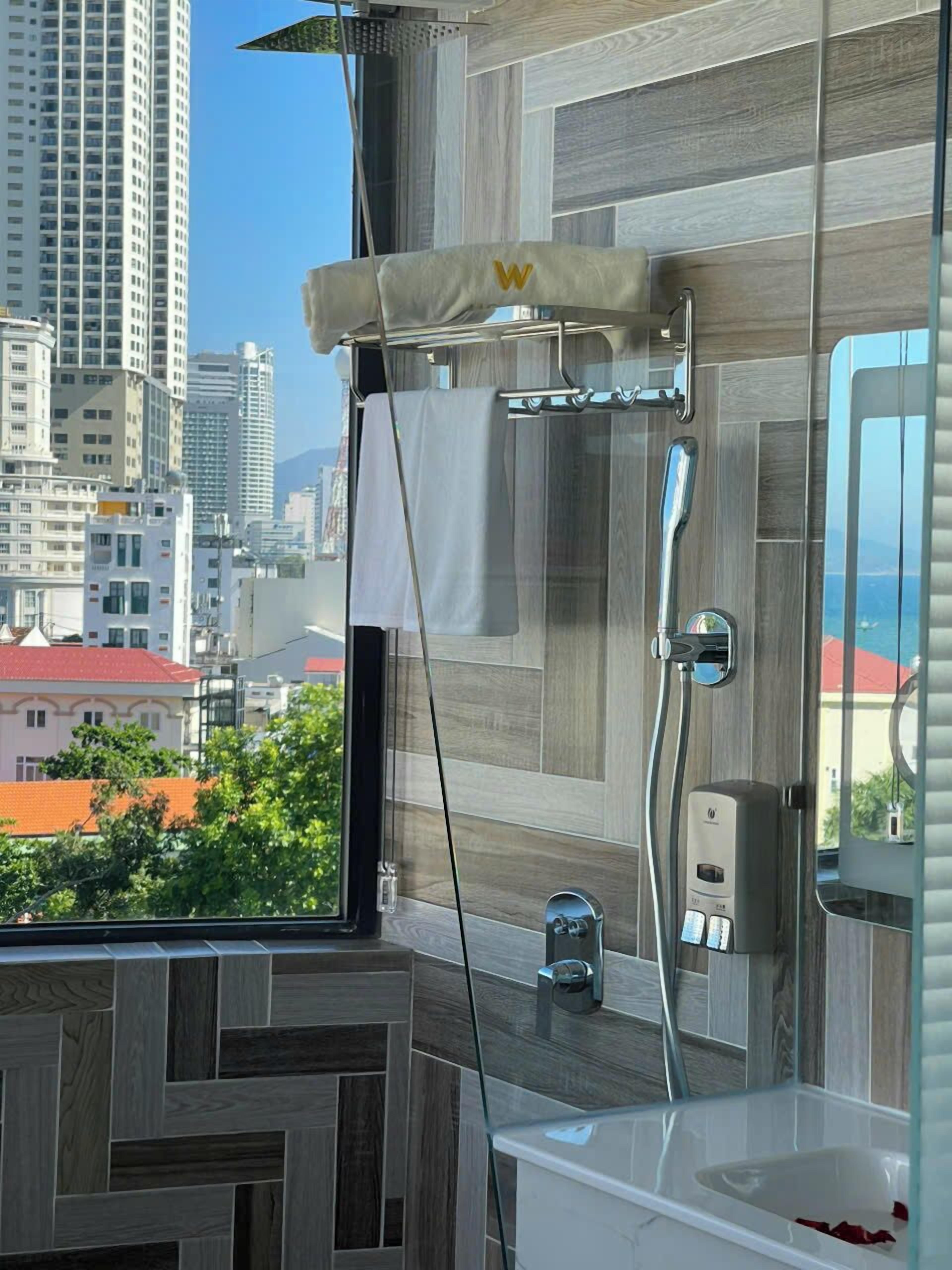 Shower, rainfall showerhead, designer toiletries, hair dryer