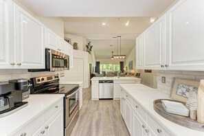 Enjoy cooking in this well-equipped kitchen with an oven, microwave, and dishwasher.