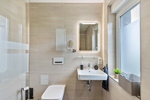 Shower, hair dryer, towels