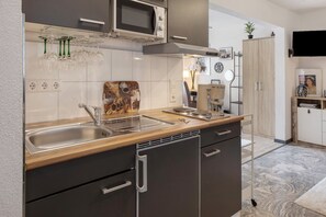 Fridge, microwave, stovetop, coffee/tea maker