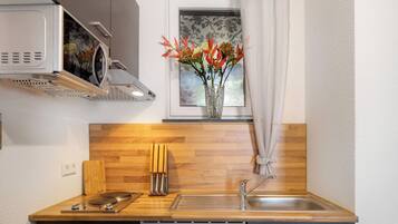 Fridge, microwave, stovetop, coffee/tea maker