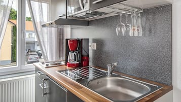 Fridge, microwave, stovetop, coffee/tea maker