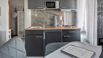 Fridge, microwave, stovetop, coffee/tea maker