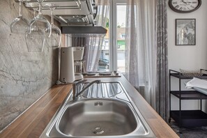 Fridge, microwave, stovetop, coffee/tea maker