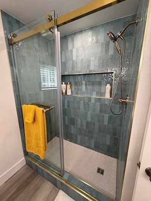 Shower, hair dryer, towels, soap