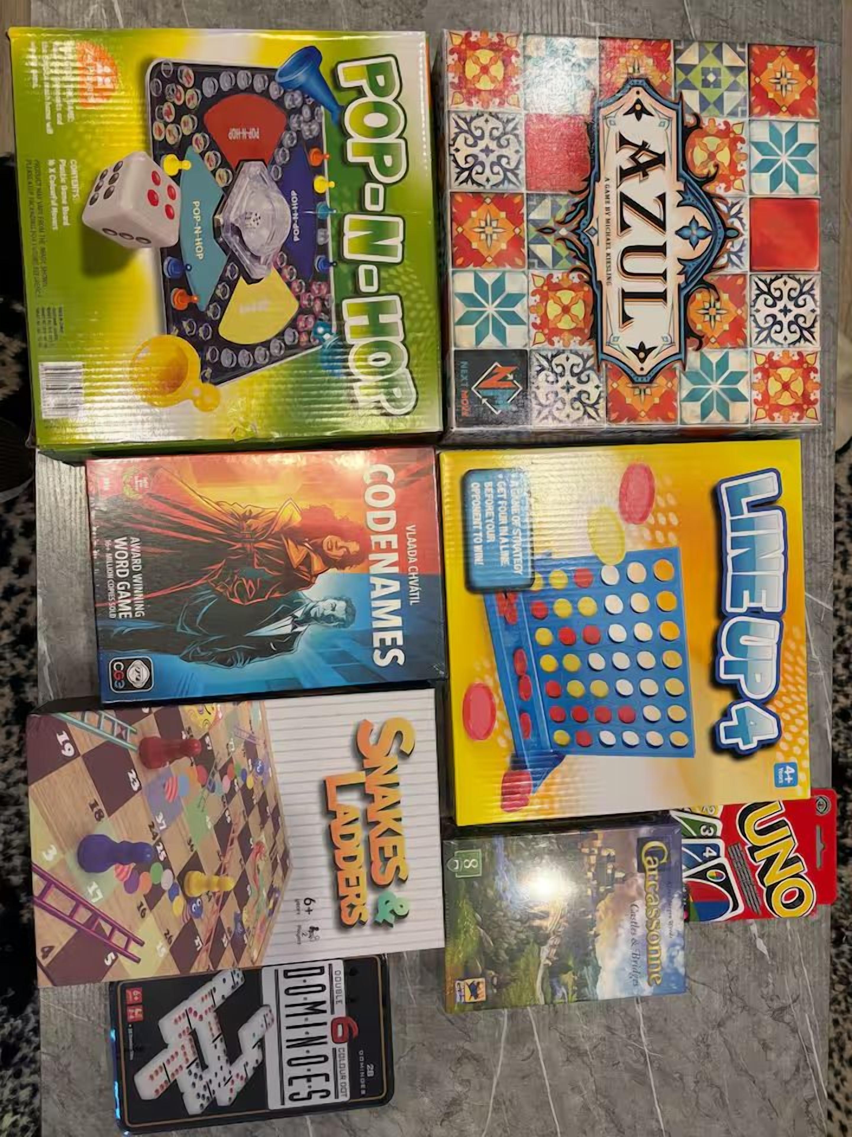 A collection of board games with various designs and themes.