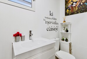 Shower, hair dryer, towels, toilet paper