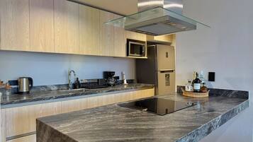 Fridge, microwave, stovetop, coffee/tea maker