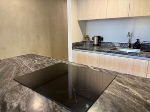 Fridge, microwave, stovetop, coffee/tea maker