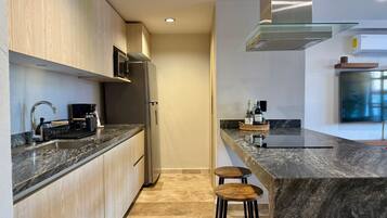 Fridge, microwave, stovetop, coffee/tea maker