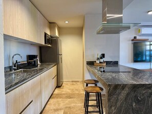 Fridge, microwave, stovetop, coffee/tea maker