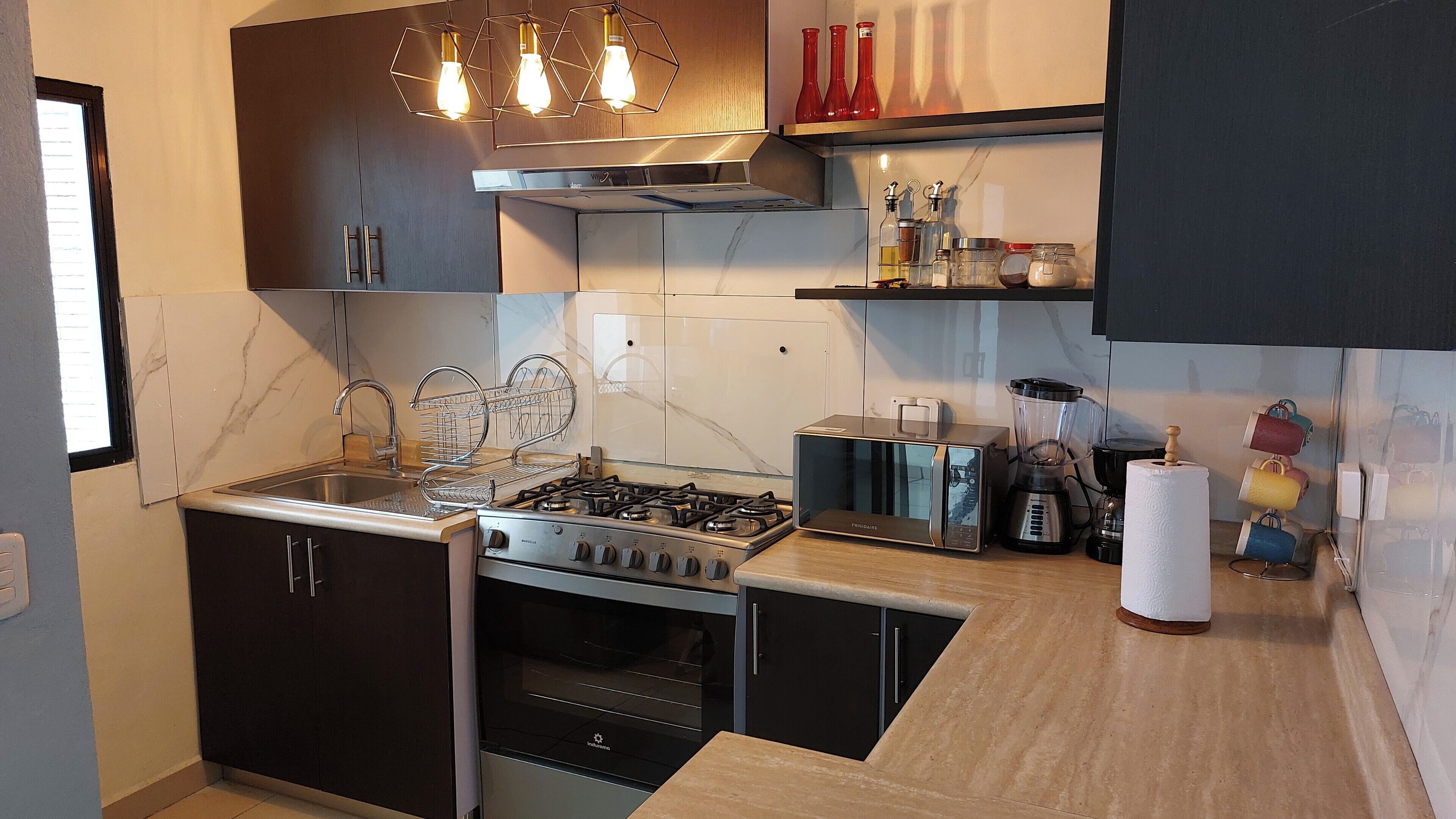 Microwave, oven, coffee/tea maker, cookware/dishes/utensils