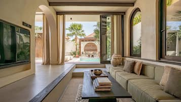 Villa, 2 Bedrooms, Patio, Pool View | Living room | 55-inch TV with cable channels