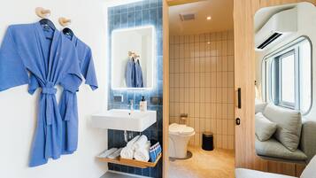 Basic Suite, 1 King Bed | Bathroom | Shower, free toiletries, hair dryer, slippers