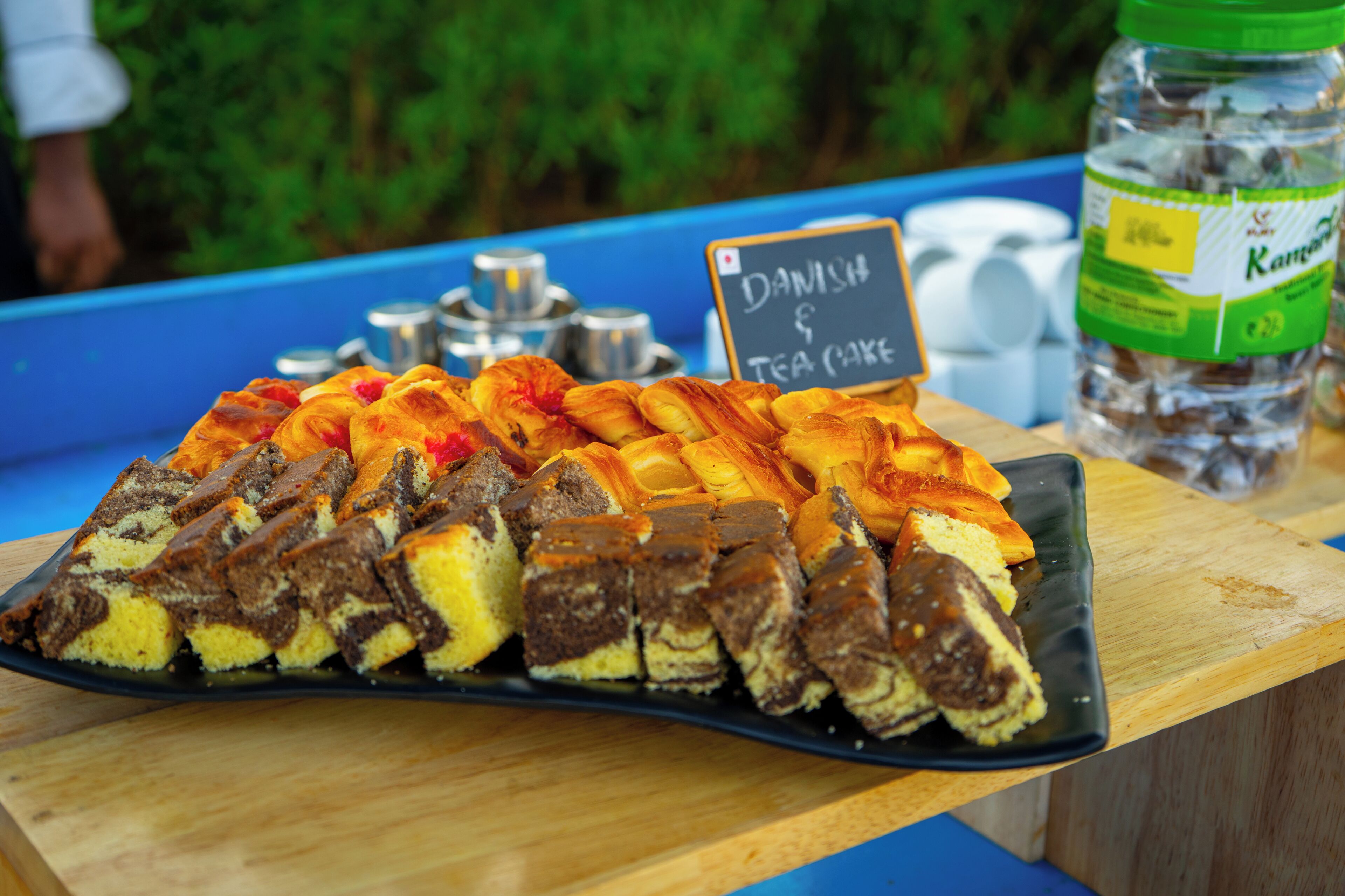 A tray of pastries with a sign indicating 'Danish Tea Cake.'