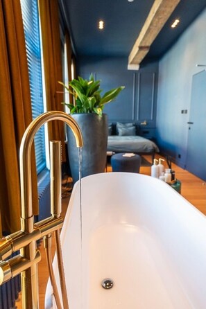 Deluxe Double Room | Bathroom | Hair dryer, bathrobes, slippers, soap