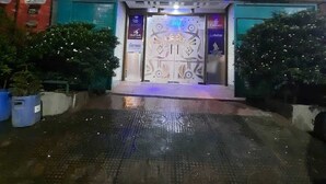 The Grand Plaza Hotel entrance with a large, ornate door and a sign above it. - Grand Plaza Hotel (Dhaka)