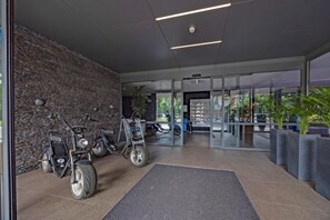 Experience the inviting atmosphere of our lobby, featuring a modern design with natural stone and glass elements.